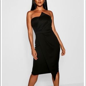 Black strapless/sleeveless dress.